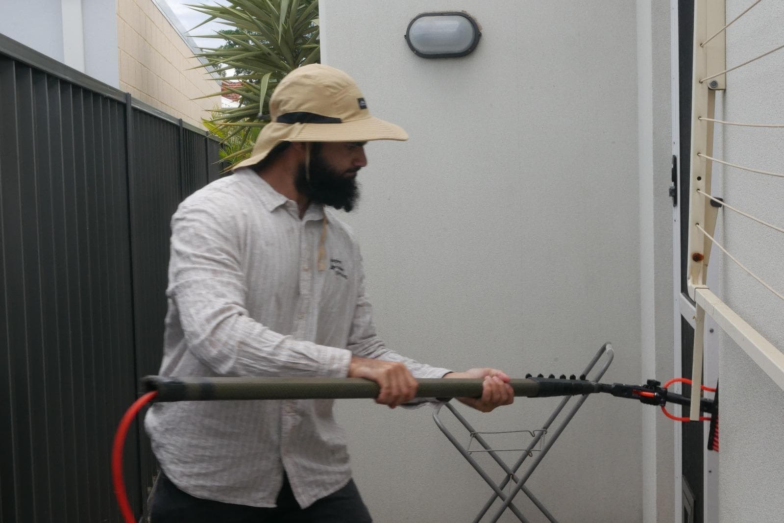 Technician cleaning solar panels in Perth